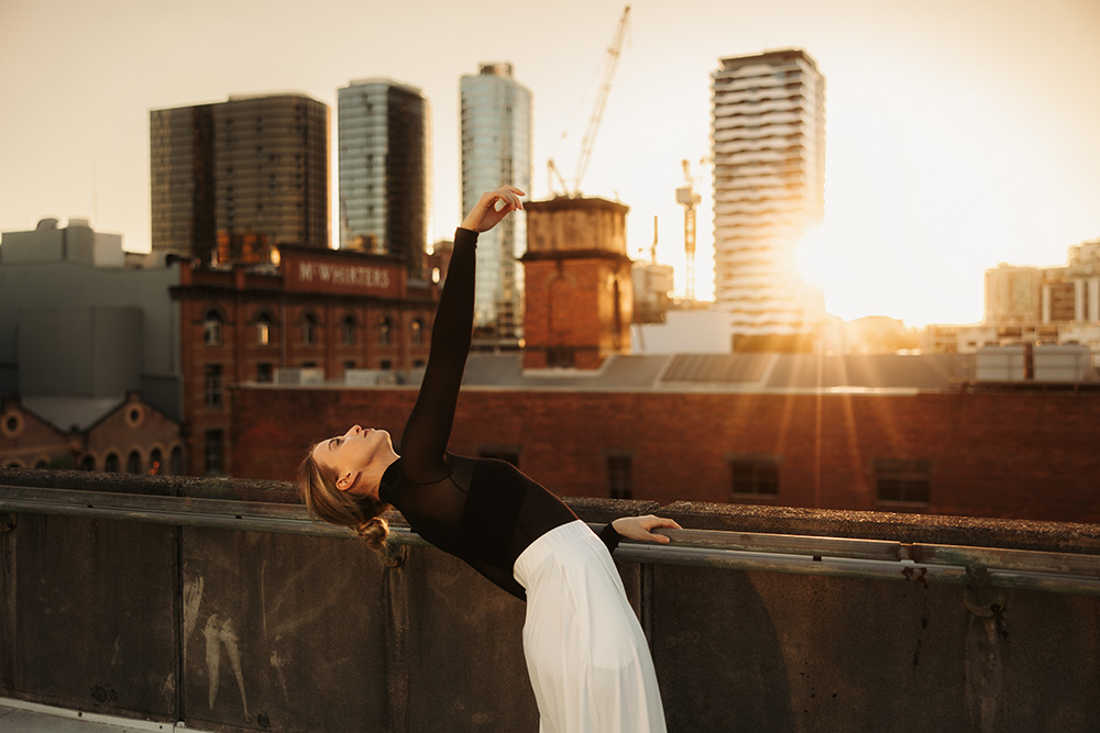 Dancer at sunset on rooftop in Brisbane by branding photographer