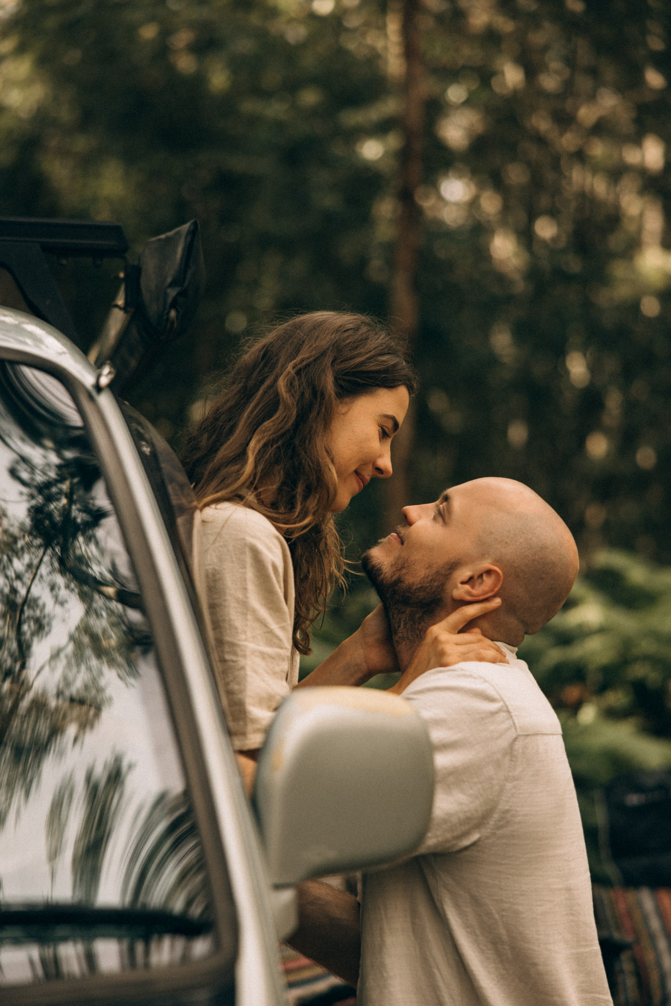 Cinematic van-life couples session in the Sunshine Coast Hinterland, capturing an intimate forest moment beside a camper van — nostalgic, emotive storytelling photography for adventurous lovers.
