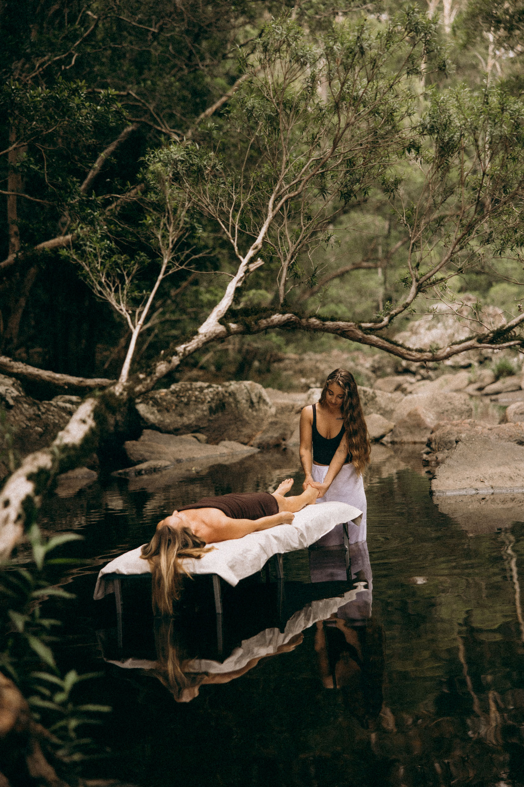 Cinematic brand photography wellness professional floating creek water Sunshine Coast dreamy natural outdoor shoot