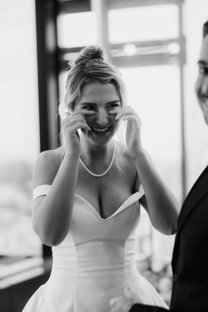Bride and groom smiling at each other just after their Brisbane Registry Office ceremony