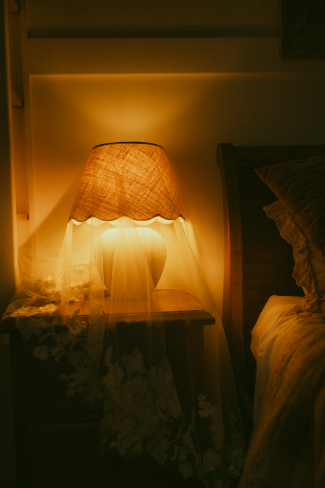 veil over a warm amber coloured light in the bridal suite at The Lake House Folk