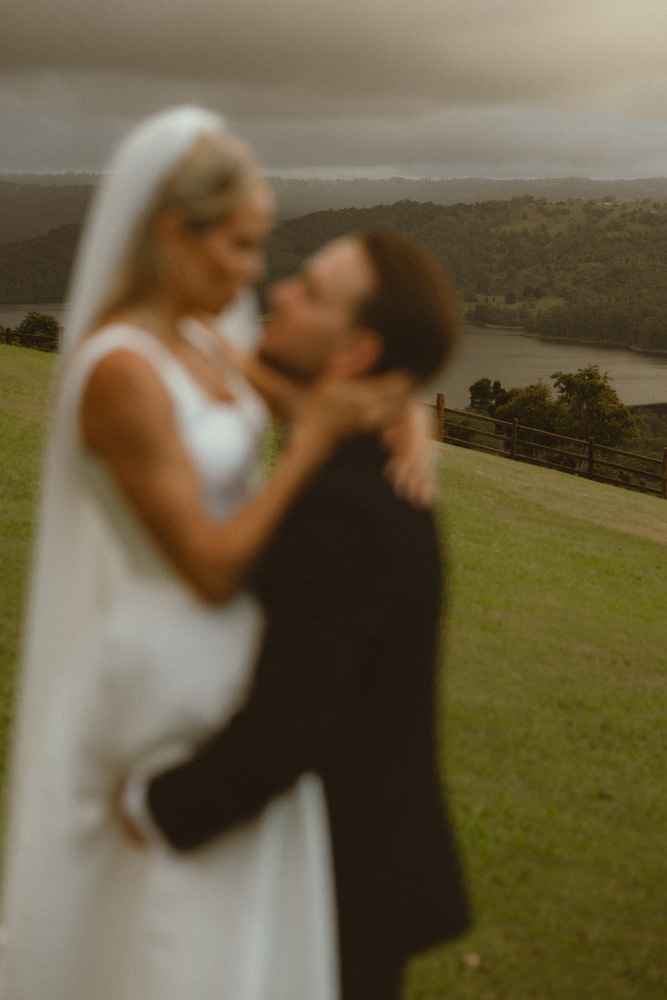 couple are out of focus with the eye being drawn to the landscape - Montville, Sunshine Coast