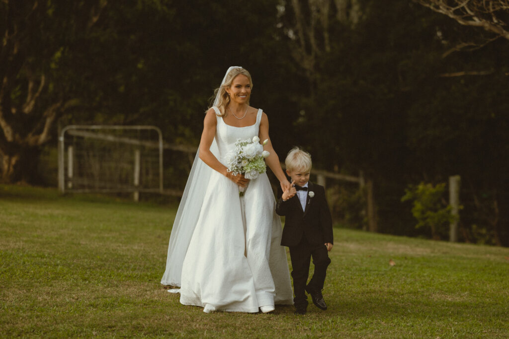 bride with young son walker her down the isle