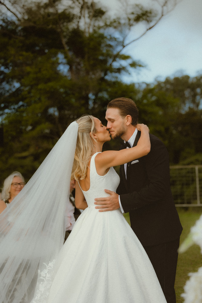 Bride and groom kissing - you may kiss the bride 