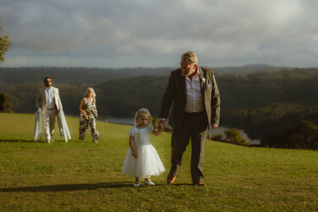 Grandfather walking granddaughter down the isle at Sunshine Coast hinterland elopement